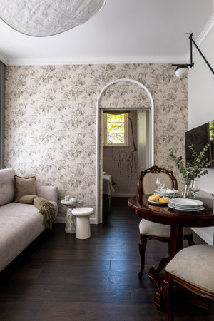 Living room with couch, table, chairs. Interior design in real estate buildingの写真素材
