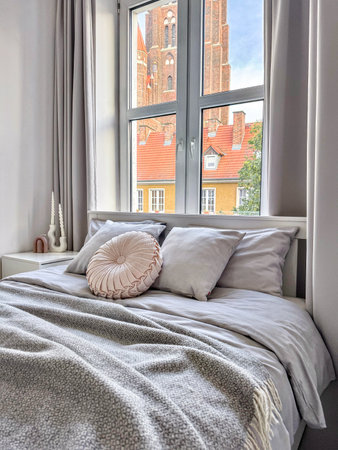 A Cozy, Modern Bedroom That Features a Beautiful Scenic View, Perfect for Relaxationの写真素材