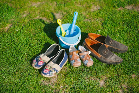 Family shoes. Parent and child shoes. Three pairs of shoes in father big, mother medium and small kid sizeの写真素材