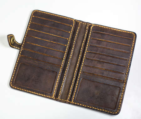 Brown leather wallet isolated on white background. Hand made leather man wallet