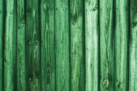Vintage wood background. Grunge wooden weathered oak or pine textured planks. Rustic green rustic fence.の写真素材