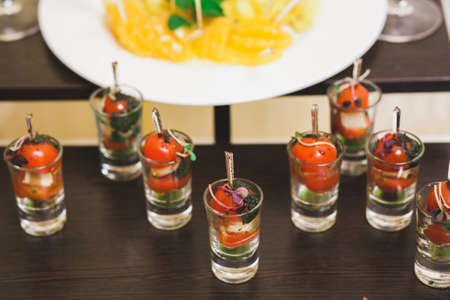 Catering for party. Close up of sandwiches, appetizers and fruit. Canapeの写真素材