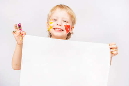 Little boy hands painted in colorful paints on whiteの写真素材