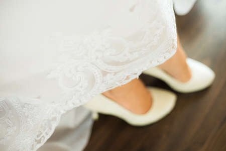 Close up image of elegant floor-length wedding dress. Concept of bride morning.の写真素材