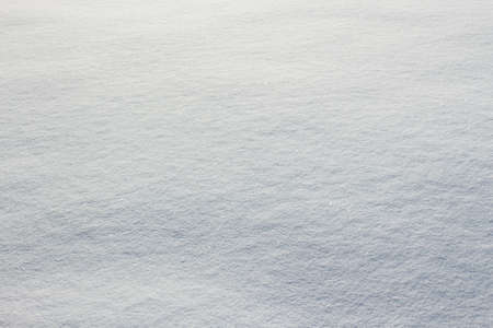 Fresh snow texture on winter ground. Horizontal color image of beautiful white natural background of snowy clean surface.の写真素材