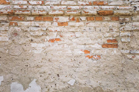 Old weathered brick wall background. Horizontal color photography.の写真素材