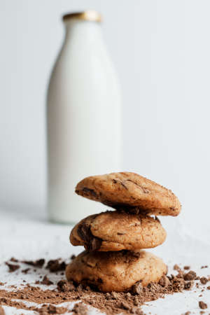 Homemade cookies on the background of a bottle of milkの写真素材