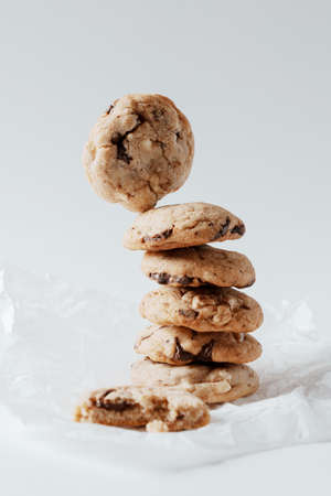 Homemade cookies with chocolate pieces on a white backgroundの写真素材