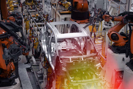 Car manufacturing plant, top view of a robotic welding line