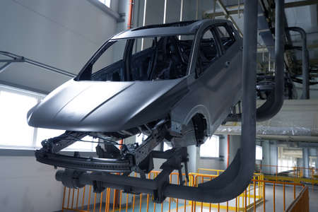 Car manufacturing plant, moving the car body around the factoryの写真素材