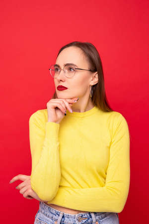 Portrait of a young woman in a yellow jacketの写真素材
