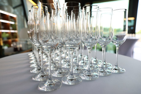 Clean empty glasses are on the table in the restaurantの写真素材
