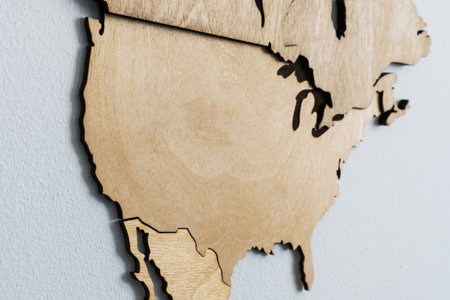 Close-up of the USA on a wooden map. Map for marking the countries visited by the traveler.