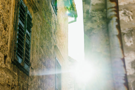Close-up of the walls of historical streets in the sunlightの写真素材