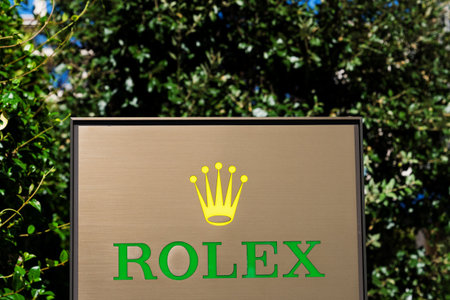 Tivat, Montenegro - February 15, 2023: Rolex company logo at a luxury resort against the backdrop of green treesのeditorial素材