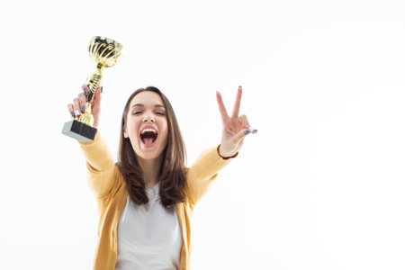 Woman is happy to win the cup. emotional portraitの写真素材