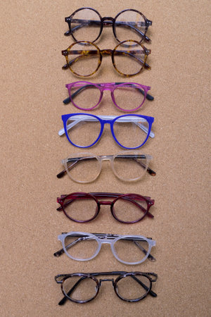 Different eyeglass frames on cork boardの写真素材