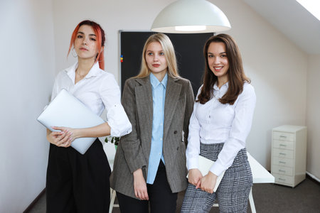 Photo of a small team of colleagues of three people. business incubator, startupの写真素材