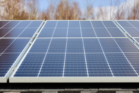Energy efficient country house. Solar panels on the roof. Electrification with renewable energy...