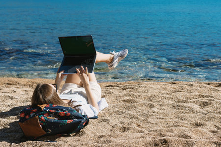 Finding solace in the synergy of nature and technology, a young woman embraces the freedom of remote...