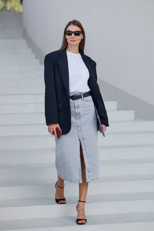 Young charming stylish careerist woman in an urban environment.の写真素材