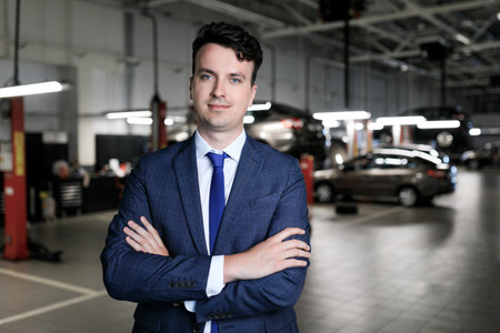 Portrait of a successful car acceptance manager for the repair of a dealership.の写真素材