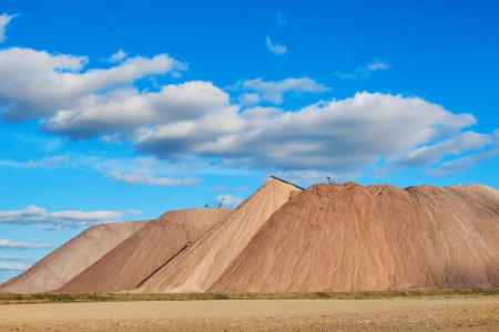 Production of potash fertilizers. Mountains of sludge waste. Sunny weather.