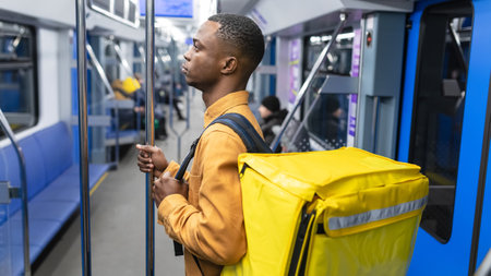 Portrait of a pizza delivery man who rides in a subway carの写真素材