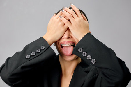 Well-groomed pretty young woman with braces close-up.の写真素材