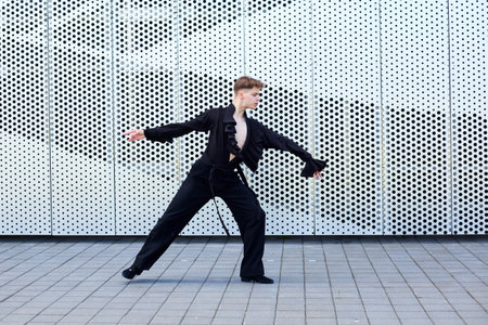 Plastic dancer man dressed in a dance costume shows dance moves.
