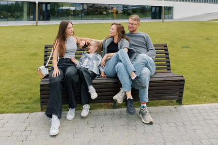 Happy parenthood, portrait of a European family with two daughters during a walk.の写真素材