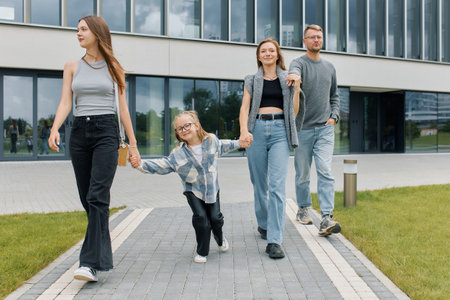 Lifestyle concept, a family of four including children went for a walk.の写真素材