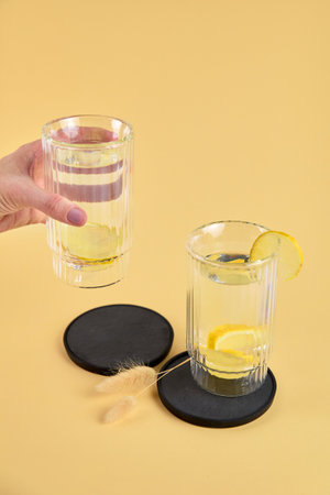 Two glasses of homemade lemonade are on the table.の写真素材