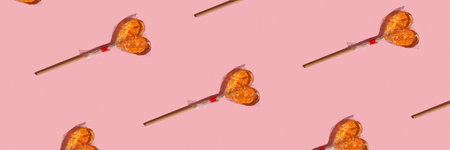 Gift packaging concept, repeating print of transparent heart shaped candies.の写真素材