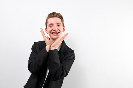 A man is seen making a hand gesture, expressing a message or communicating non-verbally.