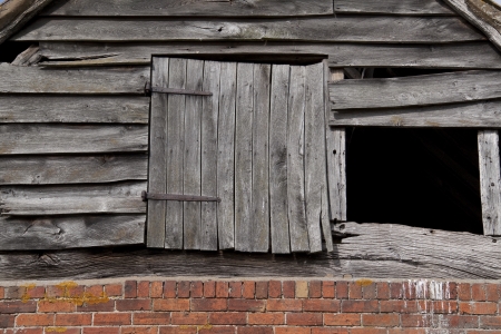 Pitch hole, used for filling the hay loft with a pitch fork, Warwickshire, England.の写真素材