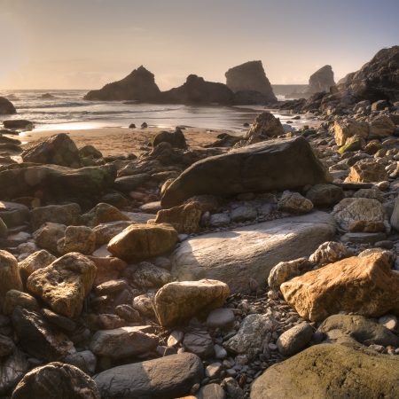 Rocks and pebbles at Bedrutahn Steps, Cornwall, England.の写真素材