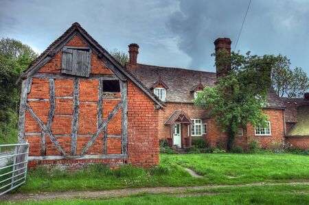 Timber-framed and brick farmhouse, Worcestershire, England.の写真素材