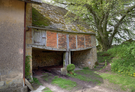 Brick and tile shelter shed with granary above, Gloucestershire, England の写真素材
