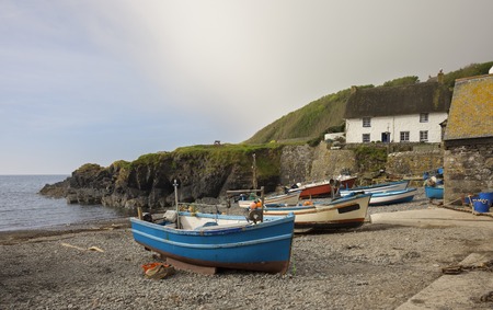 Fishing boats at Cadgwith Cove, Cornwall, Englandの写真素材