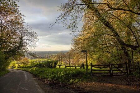 Cotswolds countryside with stile, Gloucestershire, England.