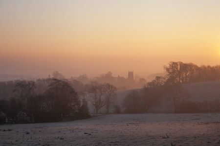 The sun rising on a winters morning over the Cotswold town of Chipping Campden, Gloucesterhisre,...