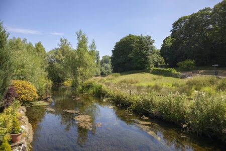 River Leach at Eastleach, Cotswolds, Gloucestershire, Englandの写真素材
