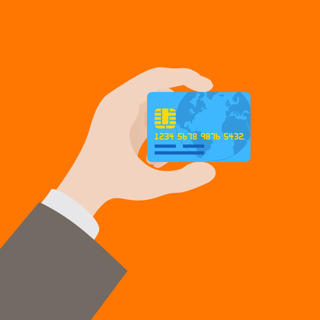 Hand holding the credit card against the orange backgroundのイラスト素材