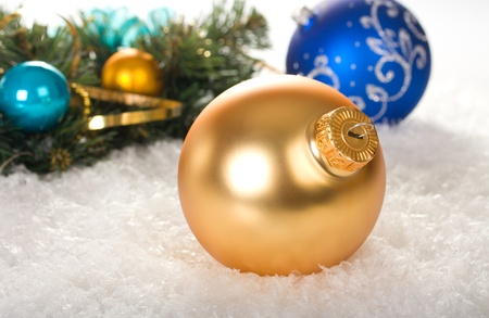 christmas decoration with balls and branch fir tree on snowの写真素材