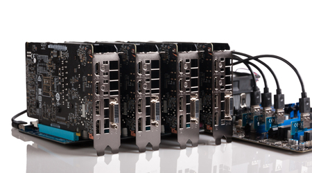 Four graphic cards are connected to the motherboard via risers card