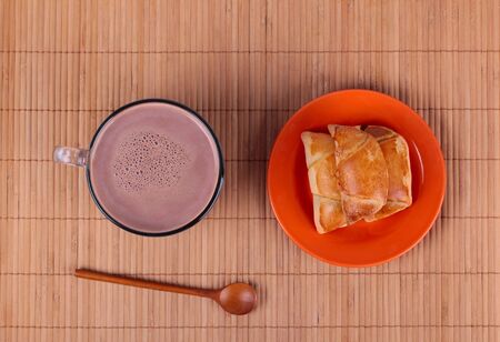 Breakfast with hot chocolate and bunsの写真素材