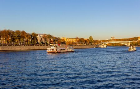 MOSCOW, RUSSIA - OKTOBER, 2018: Pleasure boat are sailing along the Moscow Riverの写真素材