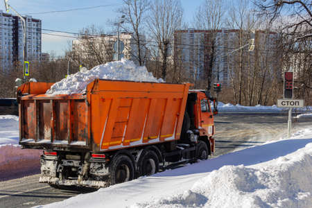MOSCOW, RUSSIA - FEBRUARY 15 2021: Dump truck loaded with snow.のeditorial素材