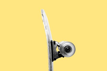Concept of youth, indie culture, being a teenager, 90s nostalgic. Half of a profile of a skateboard...